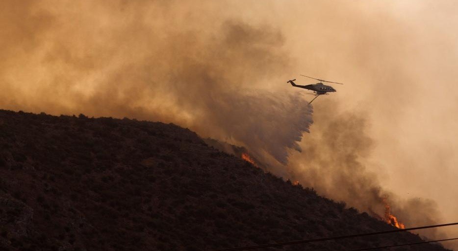 Air Force base, settlements evacuated in Greece as wildfires rage