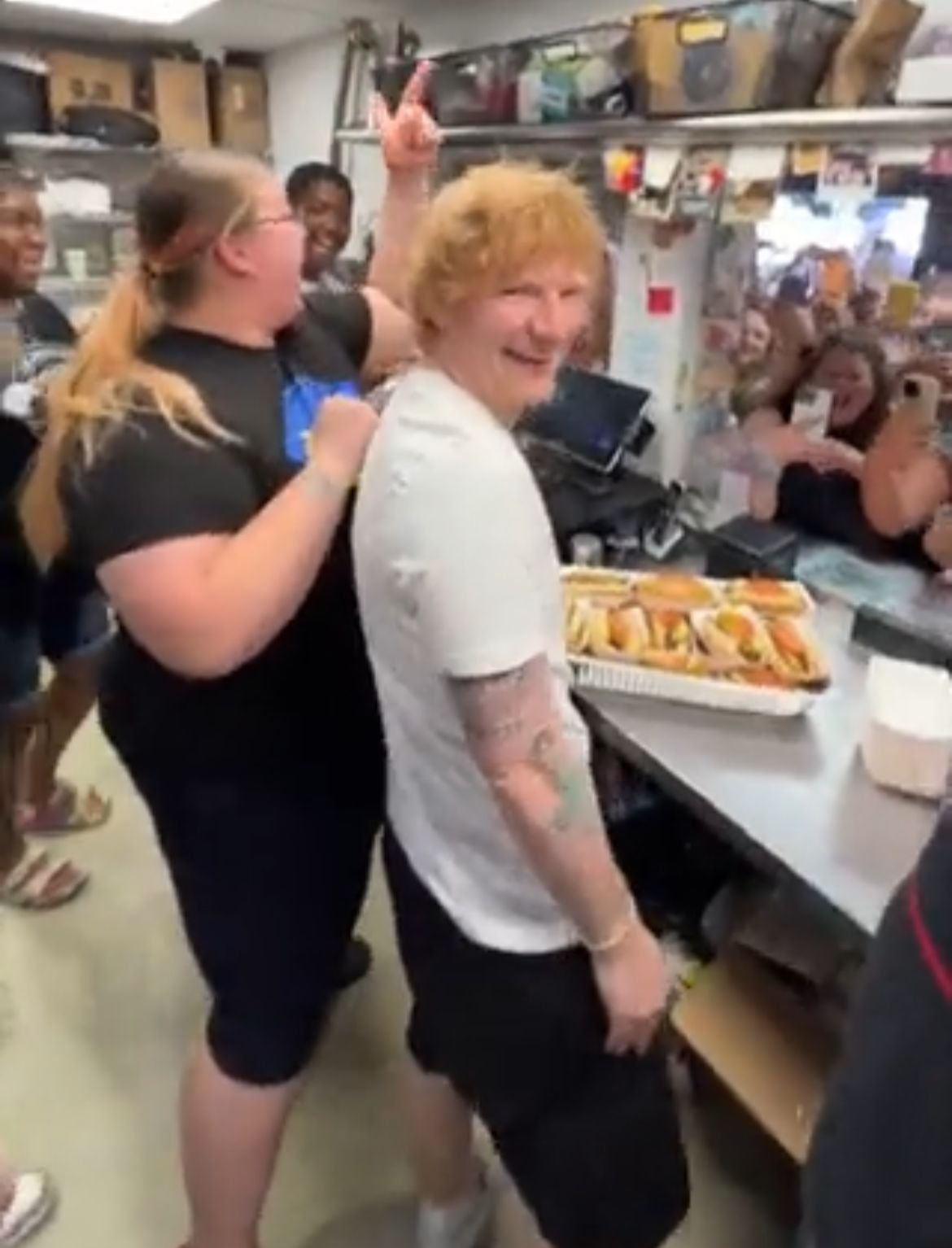 Ed Sheeran spotted serving hot dogs before sell-out concert Ed Sheeran spotted serving hot dogs before sell-out concert