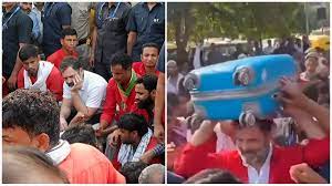 Rahul Gandhi reached railway station to meet porters, wearing trademark red shirt and carrying luggage on his head