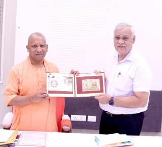Chief Minister Yogi Adityanath receives G20 postal tickets and commemorative coins at his official residence. Chief Minister Yogi Adityanath receives G20 postal tickets and commemorative coins at his official residence.