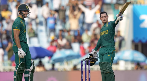 In the AUS vs SA match, Quinton de Kock notched up his second consecutive century, breaking records, and equalling AB de Villiers’ feat. In the AUS vs SA match, Quinton de Kock notched up his second consecutive century, breaking records, and equalling AB de Villiers’ feat.