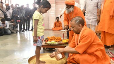 Yogi Adityanath worships the divine feminine by washing the feet of young girls