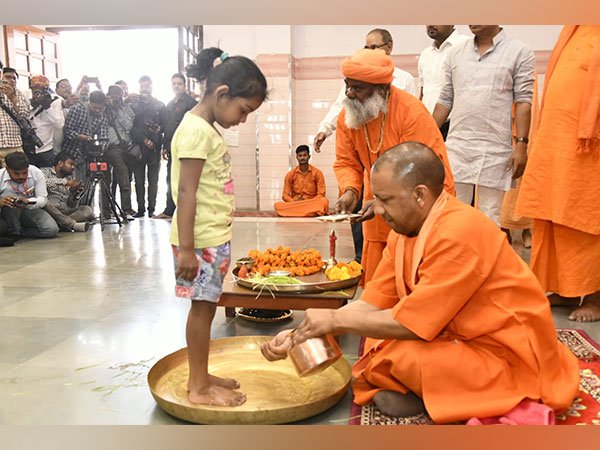 Yogi Adityanath worships the divine feminine by washing the feet of young girls